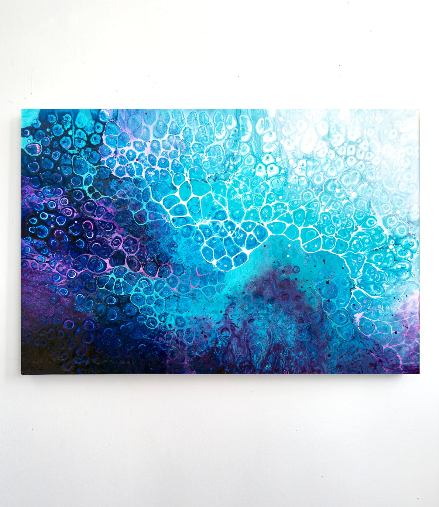 Abstract art piece with blue and purple colors on a white background