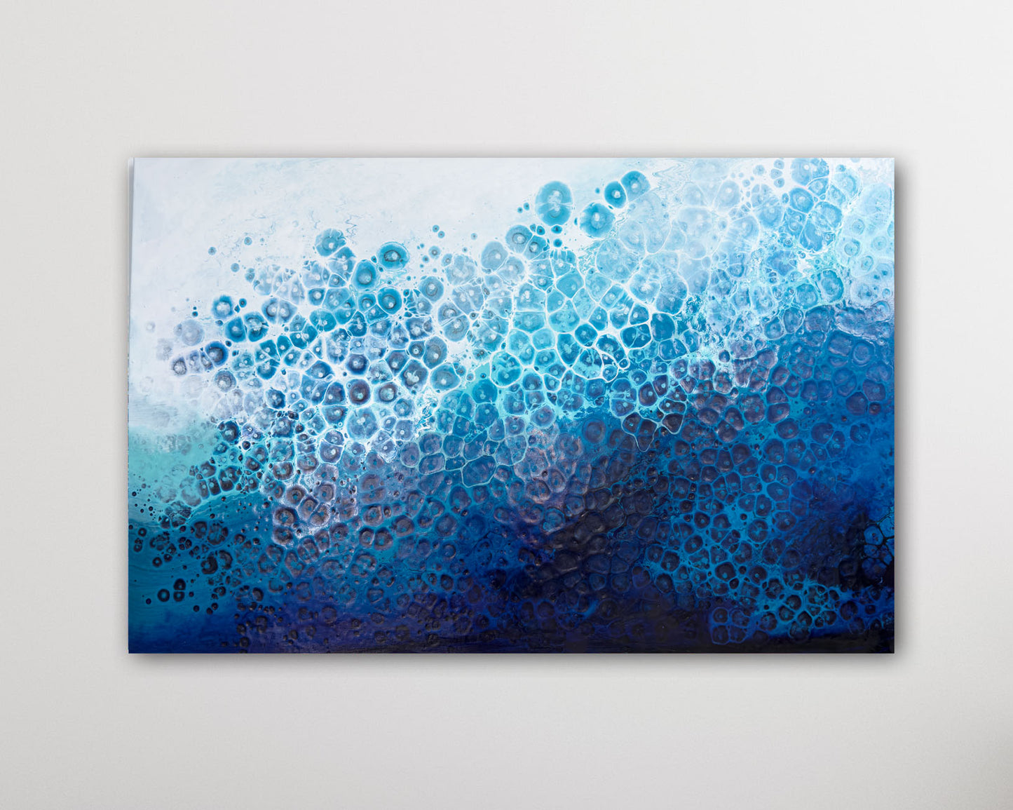 Abstract art piece with blue and black gradient on a light gray background