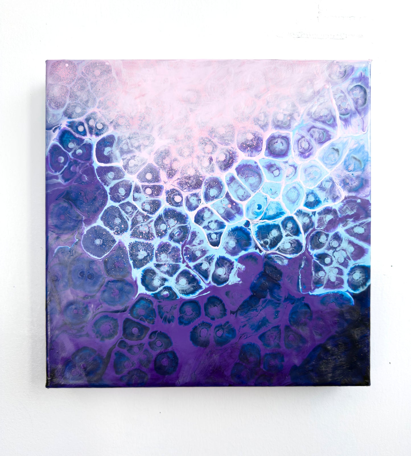 Abstract art piece with a gradient of purple and blue on a white background