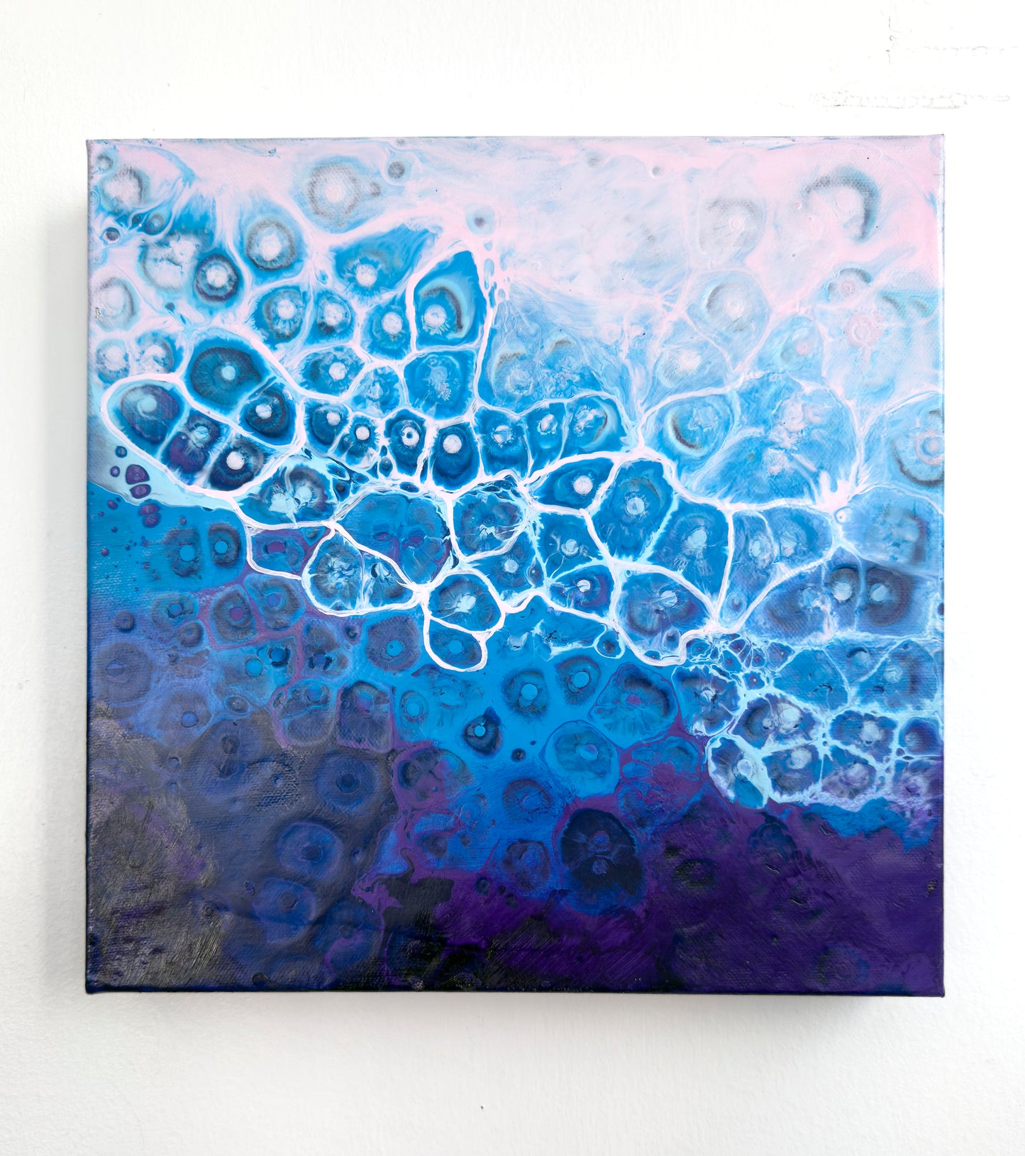 Abstract art piece with blue and purple color scheme on a white background