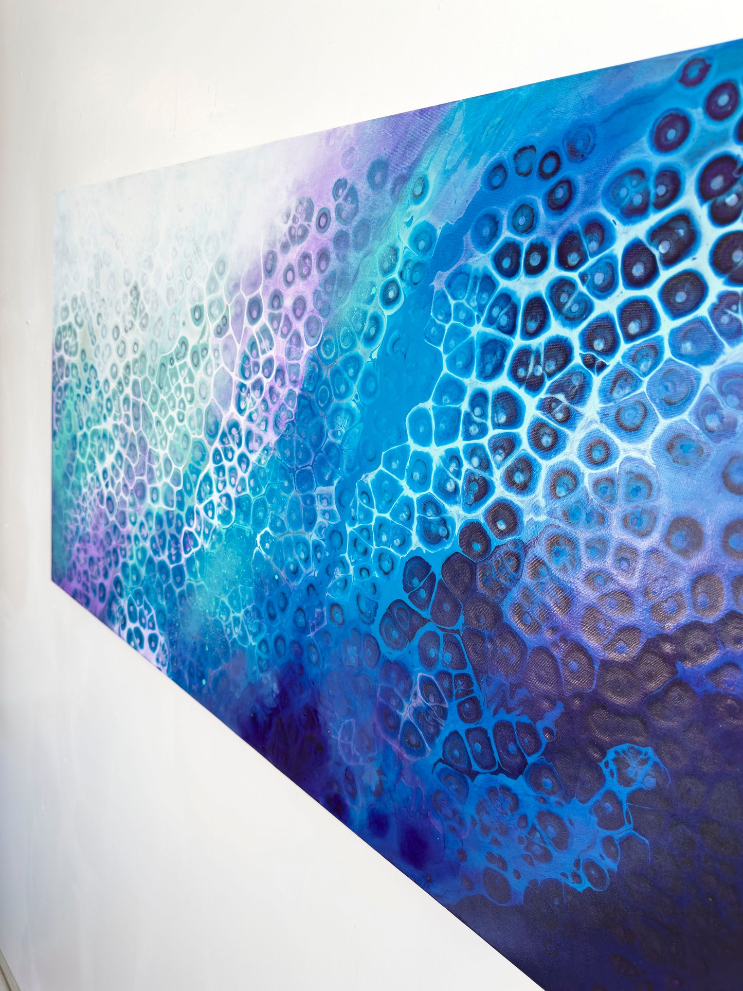 Abstract blue and purple pattern on a white wall