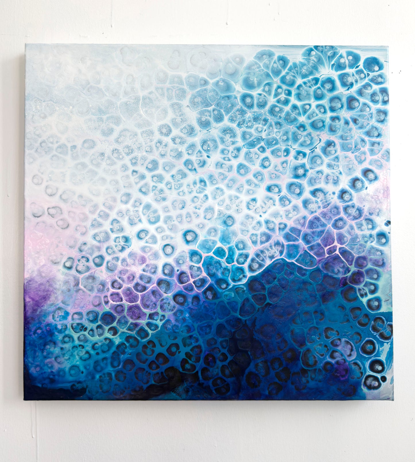 Abstract art piece with blue and purple gradient on a white background