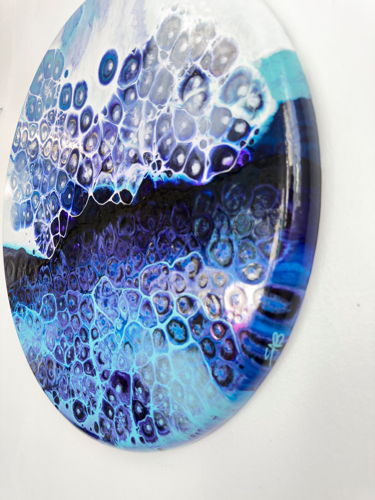 Roundabstract art with blue and purple abstract pattern on a white background