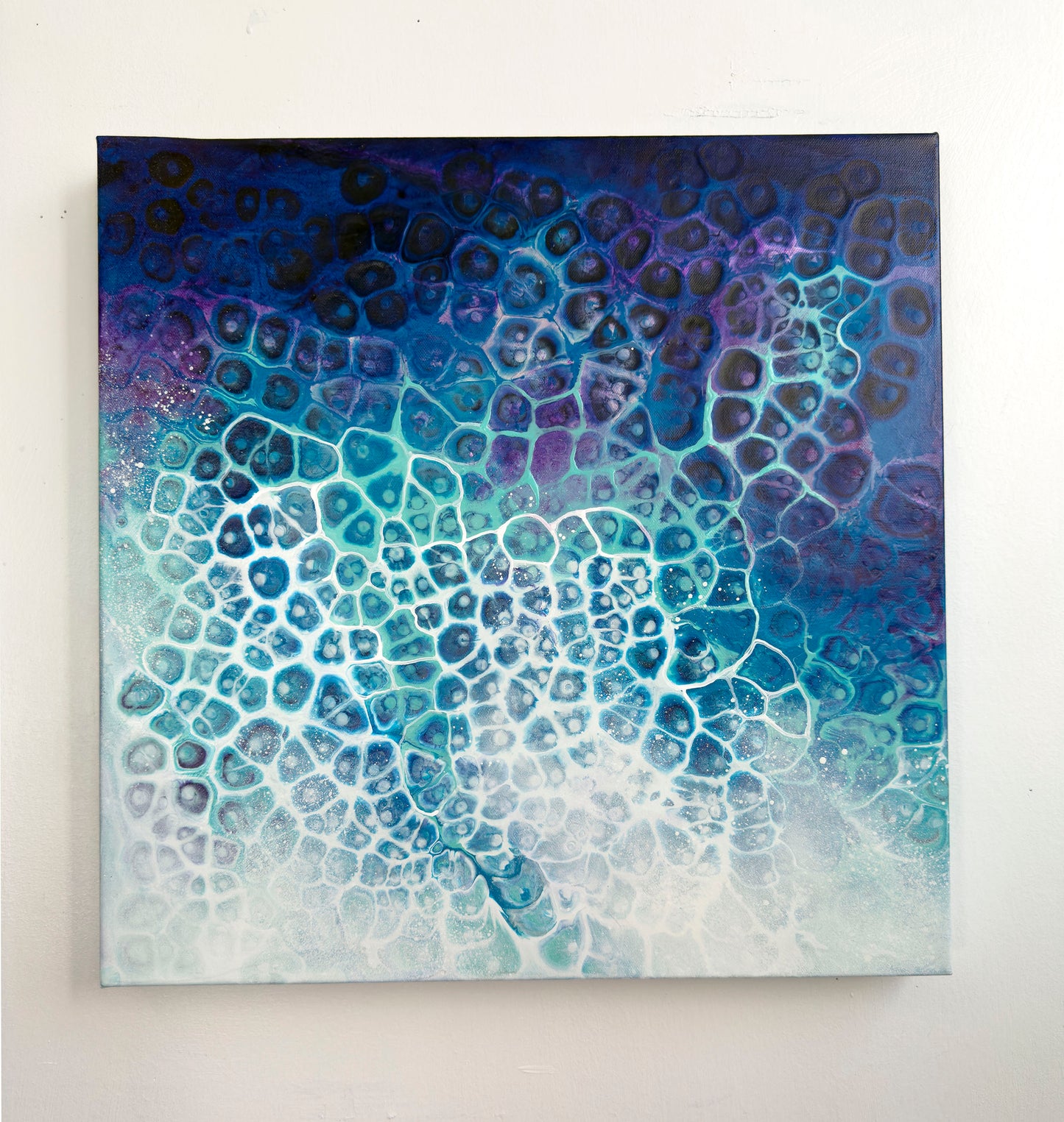 Abstract art piece with blue and purple gradient on a white background