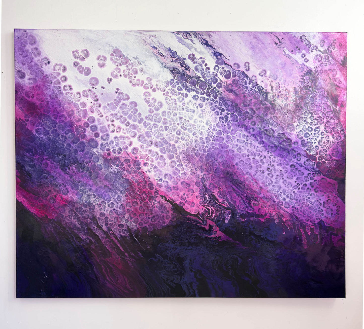 Abstract art piece with purple and pink colors on a white background