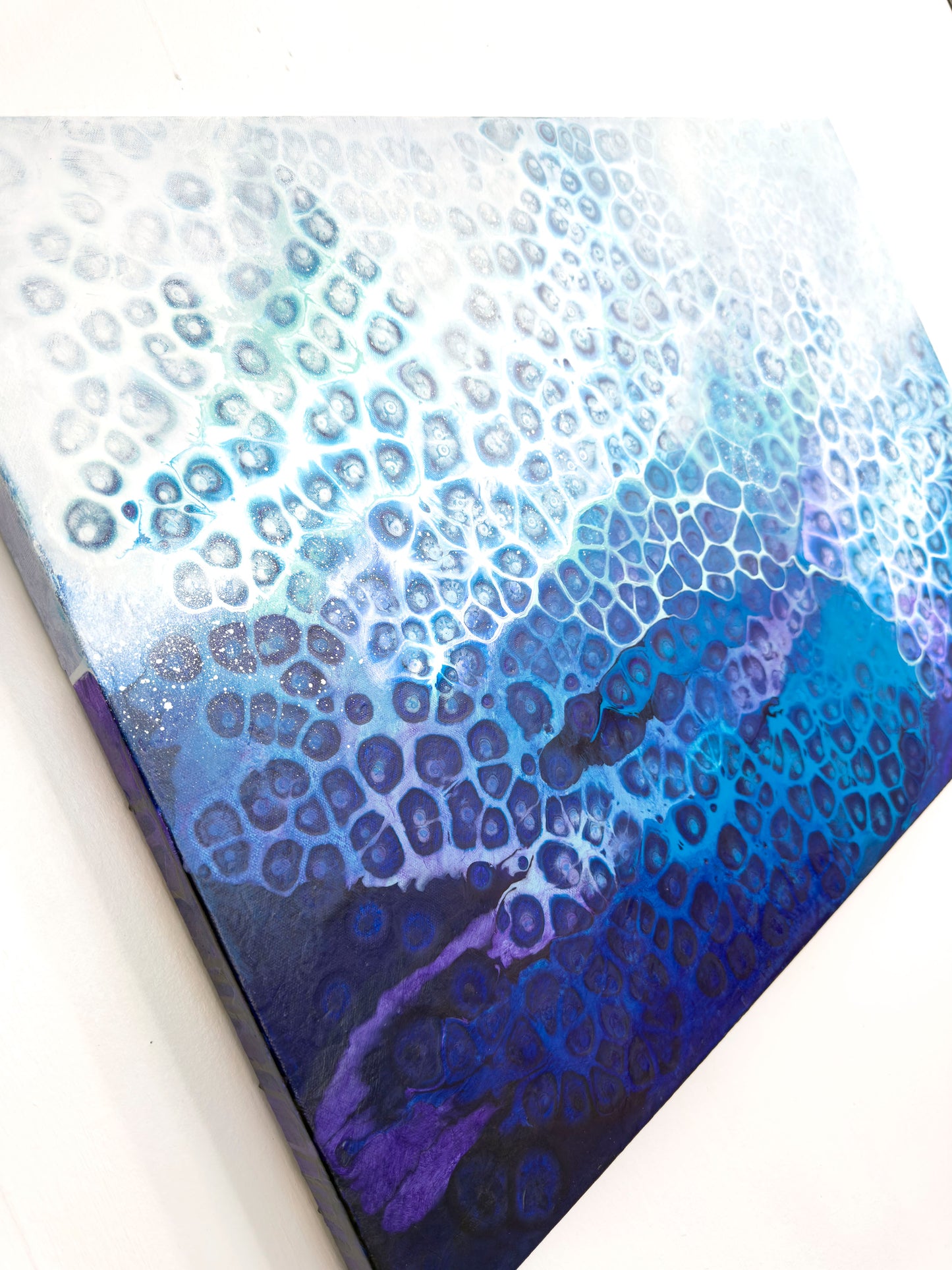 Close-up of wall art, abstract painting with a blue and purple abstract pattern