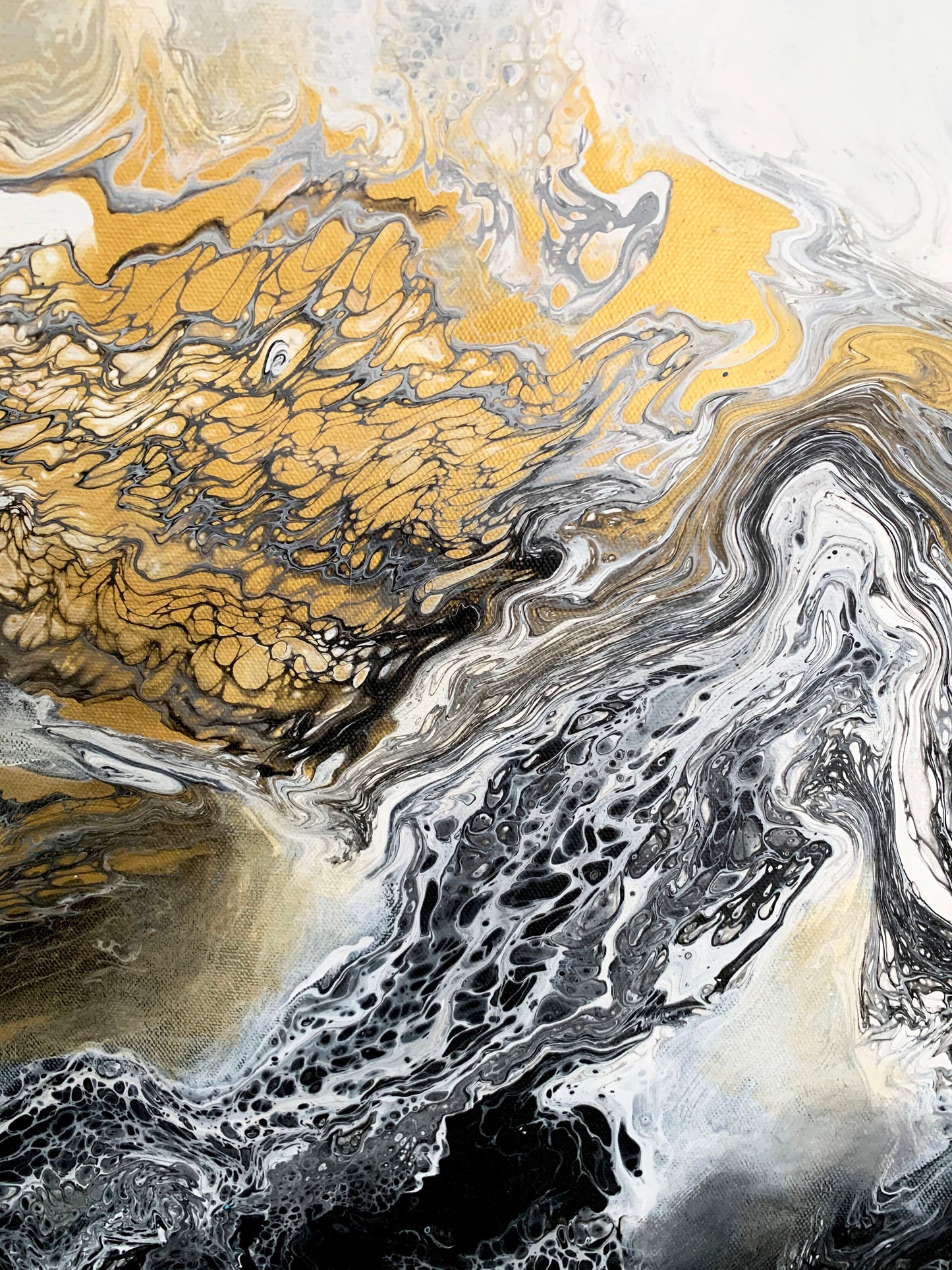 A abstract fluid painting featuring swirls of black, white, and gold colors with a textured and fluid brush stroke technique.