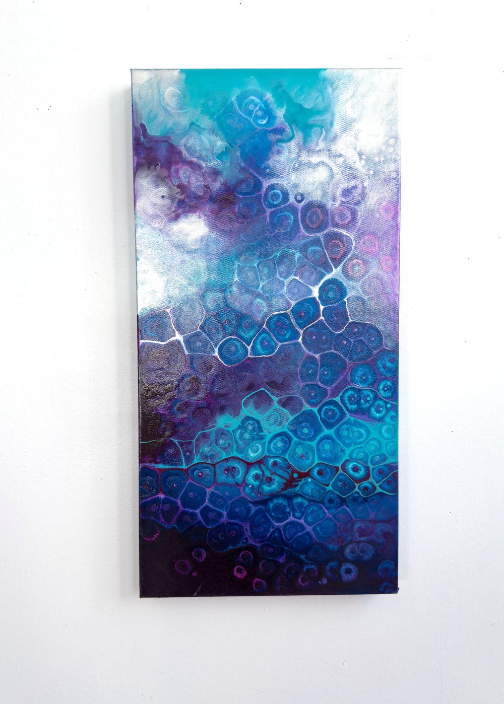 Abstract art piece with blue and purple color scheme on a white background