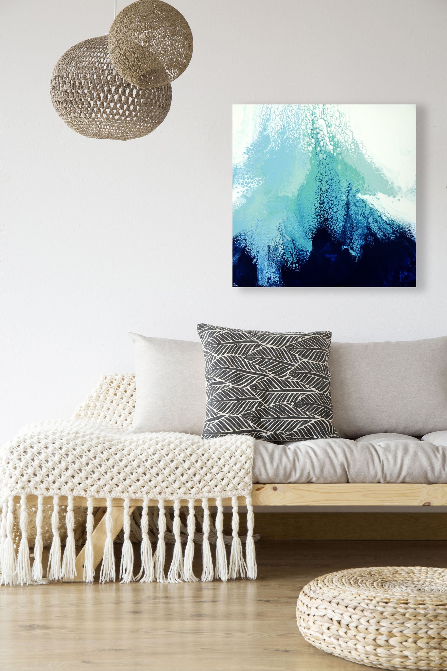 abstract ocean art blue fluid painting hanging in modern interior 